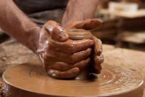 Molding the clay on the Potter’s Wheel
